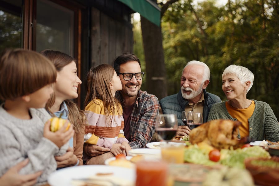 Three generations of a family at a table together